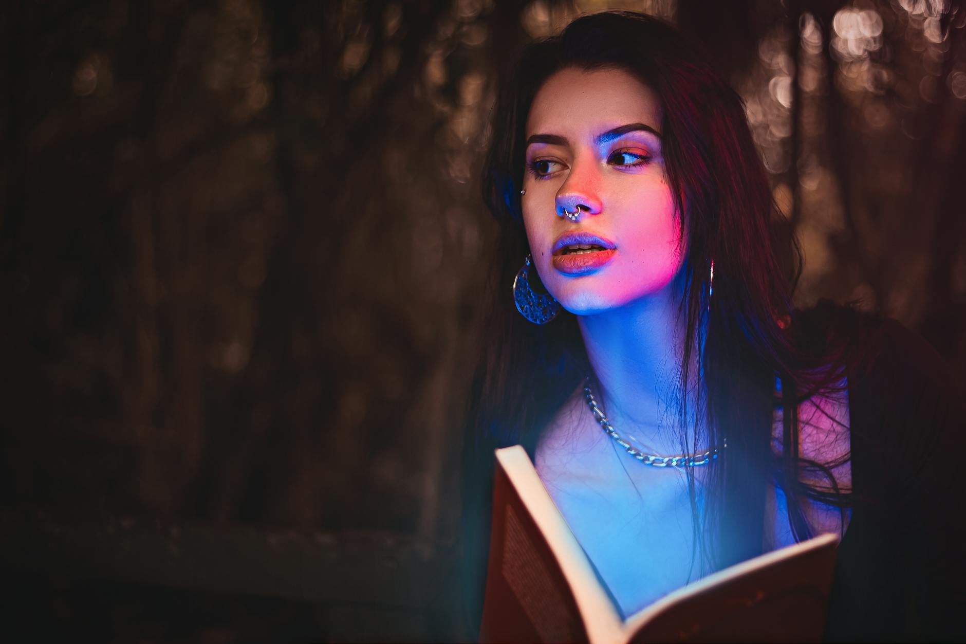 blue light over woman with book